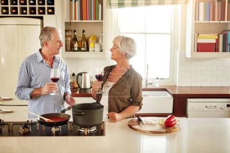 Photo for Wine, happy or old couple cooking food for a healthy vegan diet together with love in retirement at home. Smile, support or senior woman drinking or talking in house kitchen with husband at dinner. - Royalty Free Image