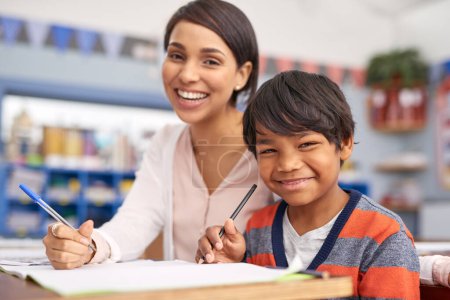 Photo for Always there for her scholars. a teacher helping an elementary school child in class - Royalty Free Image