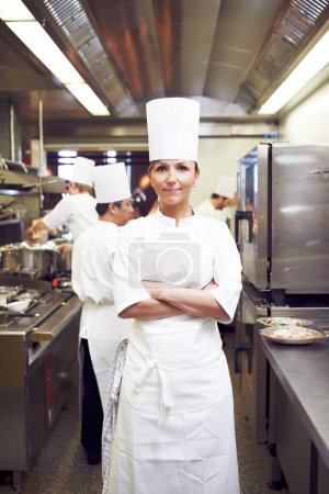Photo for Making magic in the kitchen. Portrait of a chef in a professional kitchen - Royalty Free Image