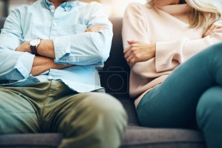 Photo for Divorce, angry and couple fight arms crossed due to family law problem in a marriage with conflict in a home lounge. Anger, living room and partner or people frustrated, depressed and mad on a sofa. - Royalty Free Image