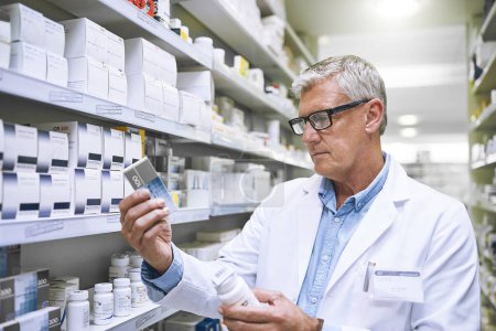 Pharmacy, medicine and search with man in store for label reading, inspection and inventory. Medical, healthcare and pills with mature male pharmacist in clinic for expert, wellness and product check.