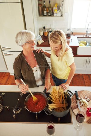 Photo for Teaching, woman or happy mother cooking food for a healthy diet together with love in family home. Funny, above or adult child learning or helping senior mom in house kitchen for lunch meal or dinner. - Royalty Free Image