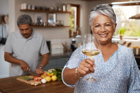 Photo for Portrait of old couple in kitchen, wine and cooking, cheers to healthy food together in home. Toast, smile and senior woman with glass in house with man, meal prep and happy lunch diet in retirement. - Royalty Free Image