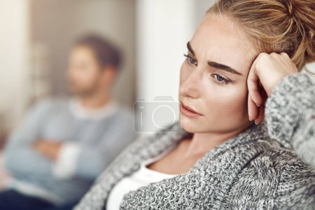 Photo for Upset, depression and woman in argument with her boyfriend in the living room of their apartment. Sad, disappointed and moody female person with conflict, fight or breakup with partner at their home - Royalty Free Image