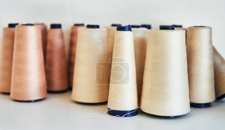 Photo for The thread that binds everything together. spools of thread in a workshop - Royalty Free Image