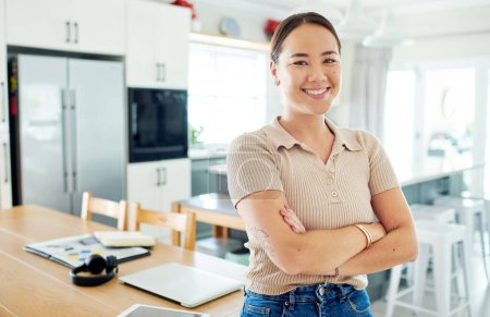 Photo for Being an entrepreneur is what Ive always wanted to do. an attractive young woman standing alone in her home with her arms folded - Royalty Free Image