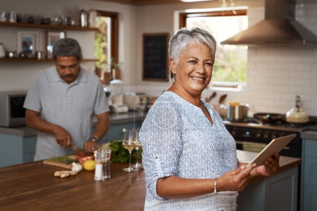 Photo for Portrait of old woman at kitchen counter with man, tablet and cooking healthy food together in home. Digital recipe, smile and senior couple with meal prep, happiness and wellness diet in retirement - Royalty Free Image