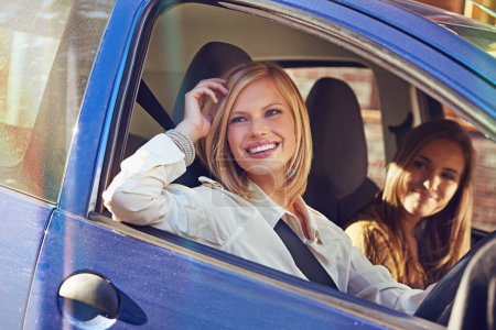 Photo for Car, travel and friends smile, happy and on urban city journey, transport or street road trip in motor vehicle. Automobile transportation, driver happiness and driving woman looking at window view. - Royalty Free Image
