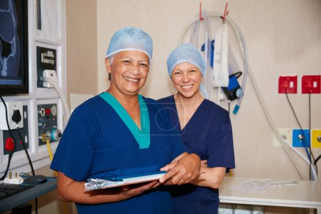 Photo for Committed to excellent care. Portrait of two surgeons working in a hospital - Royalty Free Image