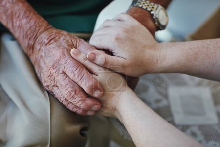 Photo for Elderly man, woman and holding hands for support with care and empathy while together for closeup. Hand of senior male and person for hope, trust and kindness or help with life insurance and health. - Royalty Free Image