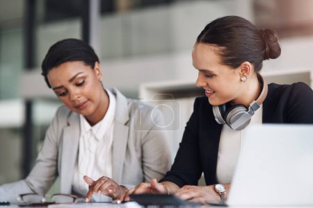 Photo for Technology makes it easier to connect and share ideas. two attractive young businesswomen working together inside a modern office - Royalty Free Image
