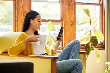 Photo for Woman, smartphone and coffee, smile at social media and communication, technology and scroll internet. Online chat, happy female relax at home with hot drink, mobile app or games with connectivity. - Royalty Free Image