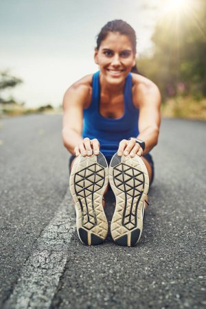 Photo for Long and lean, strong and keen. a young beautiful woman training for a marathon outdoors - Royalty Free Image