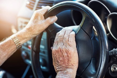 Photo for Ive been doing this driving thing for years. Closeup of an unrecognizable senior mans hands on the steering wheel of his car - Royalty Free Image