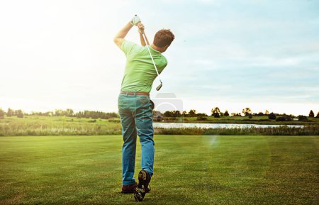 Photo for Theres power in his swing. a man practicing his swing on the golf course - Royalty Free Image