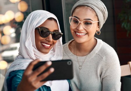 Photo for Selfie, happy muslim and women or friends in city for social media, influencer content creation and fashion blog. Young gen z people in Saudi Arabia with profile picture, photography and sunglasses. - Royalty Free Image