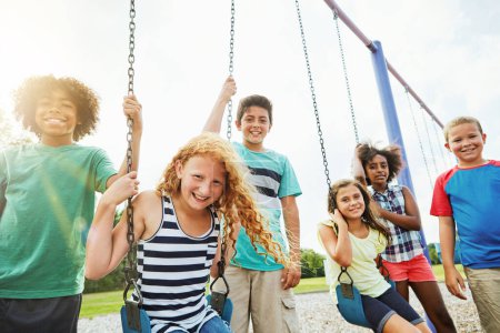 Photo for Welcome to our favourite hangout. Portrait of a group of young children playing together at the park - Royalty Free Image