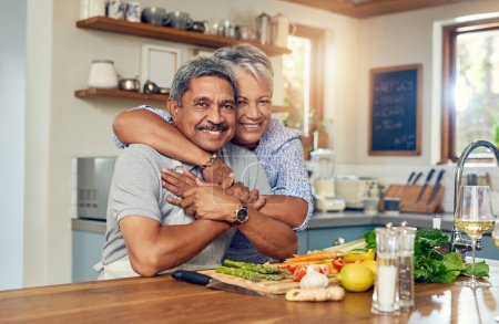 Photo for Love, hug and cooking, portrait of old couple in kitchen with healthy food, happiness and diet together in home. Smile, senior man and woman in house for meal prep, embrace and wellness in retirement. - Royalty Free Image