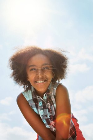 Photo for What a great day to be outside. Portrait of a happy girl standing outside on a bright summers day - Royalty Free Image