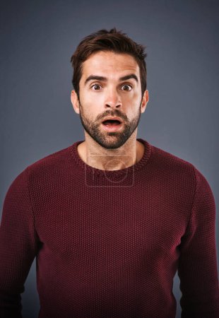 Photo for Im speechless. Studio shot of a handsome young man looking surprised against a gray background - Royalty Free Image