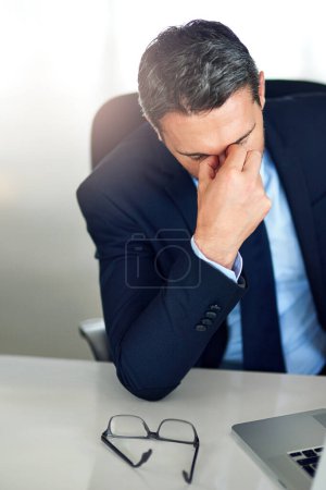 Photo for Hes reached his limit. a businessman experiencing stress at the office - Royalty Free Image
