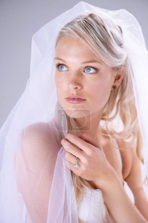 Photo for Thinking, veil and woman bride in wedding dress or with bridal makeup and cosmetics on lace in white studio background. Doubt, marriage and female person dream about serious and natural love. - Royalty Free Image