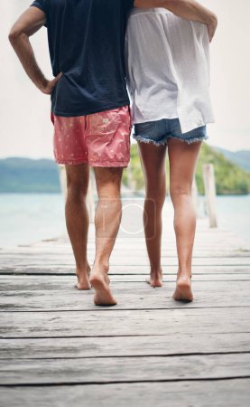 Photo for Couple, relax walking and beach deck on holiday with freedom and love in summer in Thailand. Tropical nature, sea and back of people on a boardwalk walk in the sun on vacation break by ocean water. - Royalty Free Image