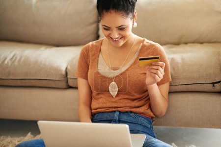 Photo for Woman in living room, laptop and credit card with online shopping and payment on store website with fintech. Female person at home, smile and happy with internet banking, finance and e commerce. - Royalty Free Image