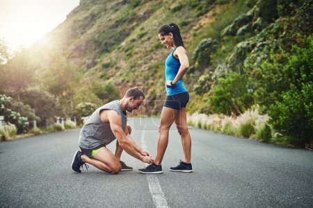 Photo for I love him for all the little things he does. a young attractive couple training for a marathon outdoors - Royalty Free Image