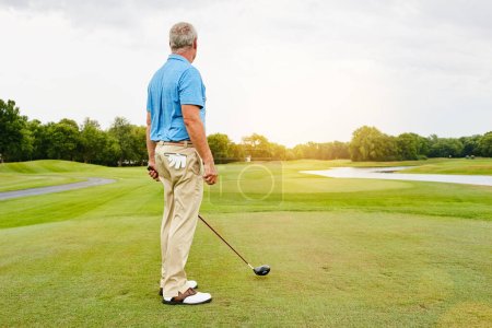 Photo for I like my courses uncrowded. a mature man out playing golf in his free time - Royalty Free Image