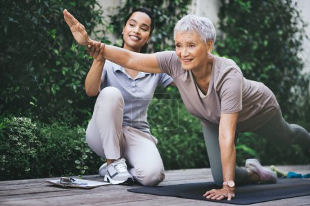 Photo for Renewed lease on life. an older woman doing light floor exercises during a session with a physiotherapist outside - Royalty Free Image