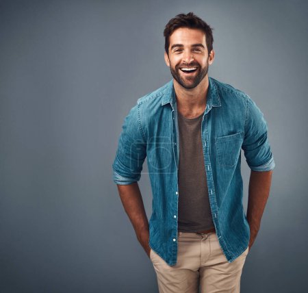 Photo for Portrait, mockup and man with a smile, fashion and confident guy against a grey studio background. Face, male person and model with happiness, casual outfit and laugh with clothes, relax and funny. - Royalty Free Image