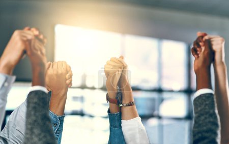 Photo for In solidarity there is strength. a group of businesspeople holding hands in solidarity - Royalty Free Image