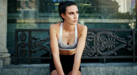 Photo for Set goals and figure out a way to get them. a young woman taking a break from her workout in the city - Royalty Free Image