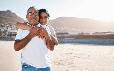Photo for Hug, portrait and a senior couple at beach for a retirement holiday, travel and a date in Bali. Happy, love and an elderly man and woman with care, hugging with affection and at the sea for vacation. - Royalty Free Image