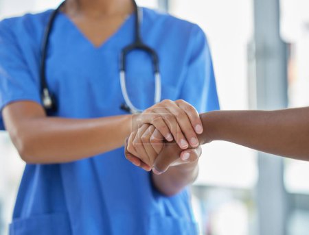 Photo for Nurse, holding hands and patient with support, help and grief consulting after cancer news. Hospital, healthcare and clinic worker with person supporting with guidance and advice from health results. - Royalty Free Image