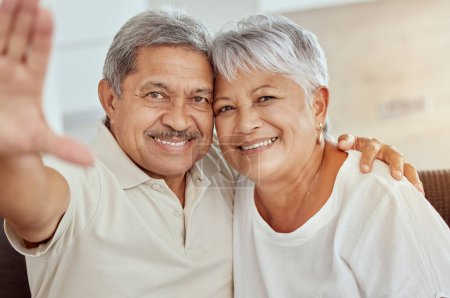 Photo for Senior couple, smile and sofa for selfie with happiness, hand and photography for blog, post or portrait in home. Elderly man, old woman and happy with smile, social media app and profile picture. - Royalty Free Image