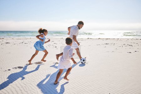 Photo for Soccer ball, fun and family at the beach with freedom, happy and bonding in nature. Running, sports and children with father at the ocean for travel, vacation and football while traveling in Mexico. - Royalty Free Image