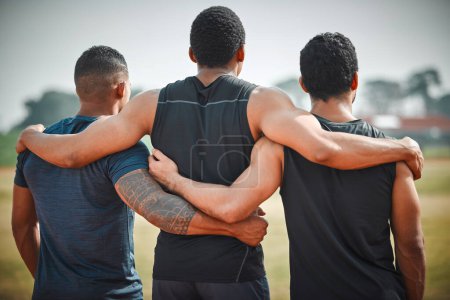 Photo for Back, group hug and athlete men with teamwork outdoor for running, sports or workout. Collaboration, hugging and rear view of people, friends and runners for fitness, support and exercise together - Royalty Free Image
