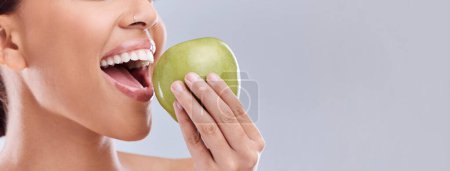 Photo for Mockup, apple bite or woman eating in studio on white background for healthy nutrition or clean diet. Closeup, space on banner or open mouth of hungry girl marketing natural green fruit for wellness. - Royalty Free Image