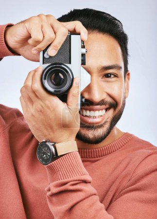 Photo for Happy man with camera, photography and smile in portrait with creativity and art isolated on studio background. Male photographer, creative with artistic person and taking pictures with gadget. - Royalty Free Image