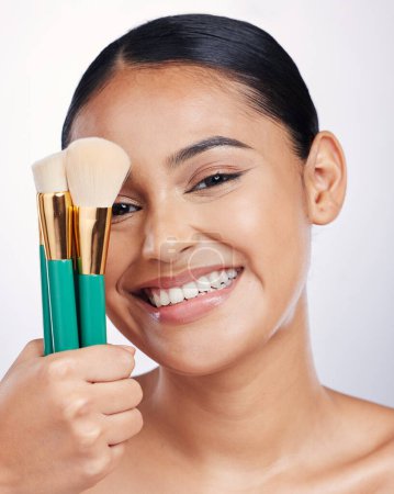 Photo for Brush for makeup, face and beauty with happy woman, foundation and portrait isolated on studio background. Female model smile, natural cosmetics and skin glow with cosmetic tools and cosmetology. - Royalty Free Image