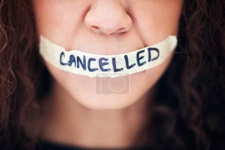 Photo for Political, protest and closeup with tape on a mouth for justice, freedom or revolution movement. Bullying, violence and zoom of a woman with cancelled on lips for feminism, activism or discrimination. - Royalty Free Image