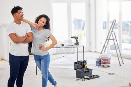 Photo for Maintenance, renovation and portrait with a couple in their new home together for a remodeling project. Construction, real estate or diy property improvement with a man and woman bonding in a house. - Royalty Free Image