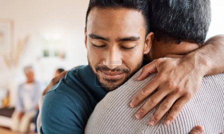 Photo for Father, son and hug for love, care or support in family bonding or time together in living room at home. Happy man hugging dad in reunion embrace, relationship or greeting for elderly care at house. - Royalty Free Image