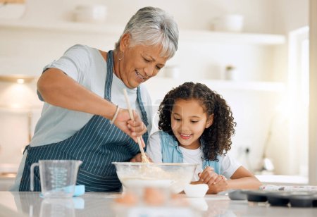 Photo for Grandmother, cooking or child baking in kitchen as a happy family with young girl learning cookies recipe. Mixing cake flour, development or grandma smiling, helping or teaching kid to bake at home. - Royalty Free Image
