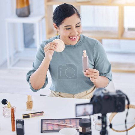 Photo for Makeup, influencer, camera and happy woman streaming tutorial for cosmetics, social media or skincare. Foundation, live stream and content creator with smile, product broadcast and beauty channel. - Royalty Free Image