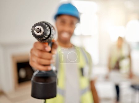 Photo for Engineer, handyman and drill in hand of a man for maintenance or carpenter work. Male construction worker, constructor or contractor with electric power tools at building site for renovation mockup. - Royalty Free Image