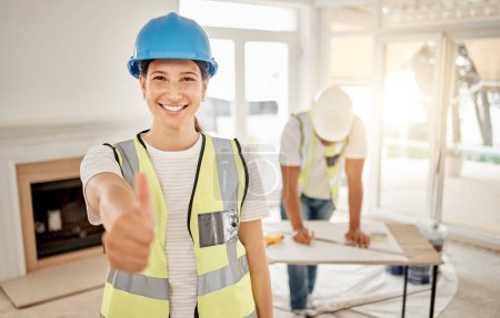 Photo for Portrait of woman, construction and home renovation with thumbs up, helmet and smile in apartment. Yes, positive mindset and diy renovations, happy female in safety and building project in new house - Royalty Free Image