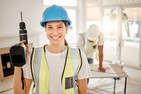 Photo for Portrait of woman, construction and home renovation with drill, helmet and smile in apartment. Yes, positive mindset and diy renovations, happy female in safety in building project tools in new house. - Royalty Free Image